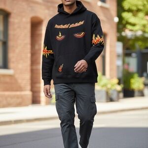 Black Sweater with Glowing Eyes and Flame Designs